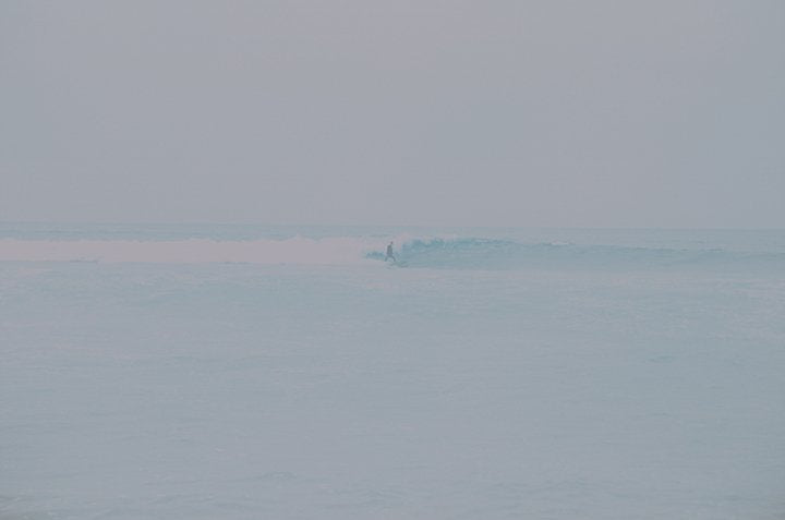 film photography color surfer riding wave