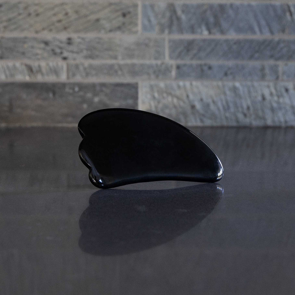 Body gua sha in black obsidian stone